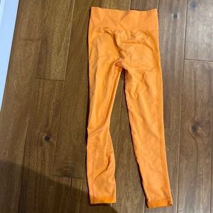 Orange colored workout leggings. Size medium. Never worn.